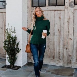 Green shoulder cut out sweater.